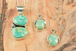 Genuine Manassa Turquoise set in Sterling Silver. Beautiful Pendant and Earrings Set. This Turquoise is also referred to as King�s Manassa Turquoise. The Manassa Turquoise mine is located in Manassa, Conejos County, Colorado. Created by Navajo Artists Berna Francisco and Lucy Valencia. Signed. Free 18